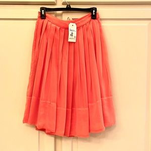 Freeway coral pleated skirt, with sheer overlay, size small.